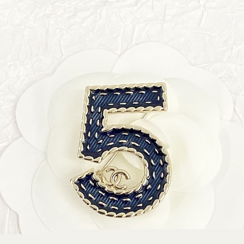 Ch*el brooches